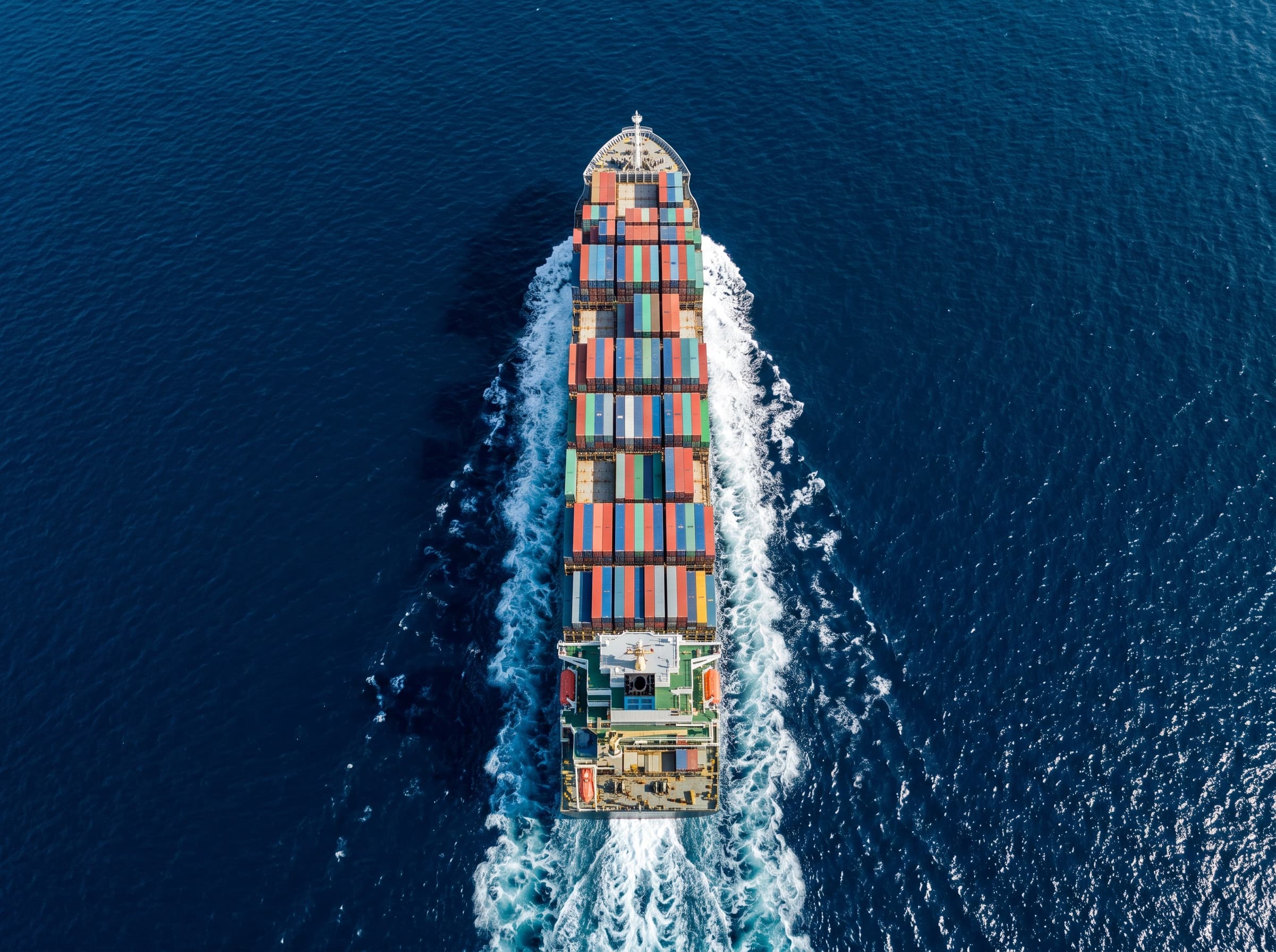 Aerial view of a loaded container ship crossing the open sea